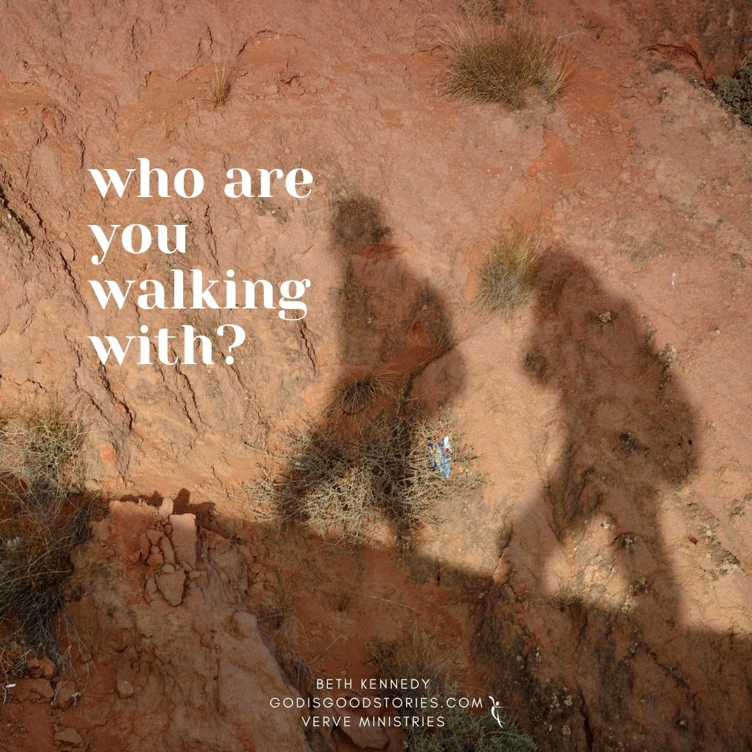 picture of the shadow of two people walking up a hill, the shadow is set upon a rock with the words 'who are you walking with? Beth Kennedy GodisgoodStories.com Verve Ministries
